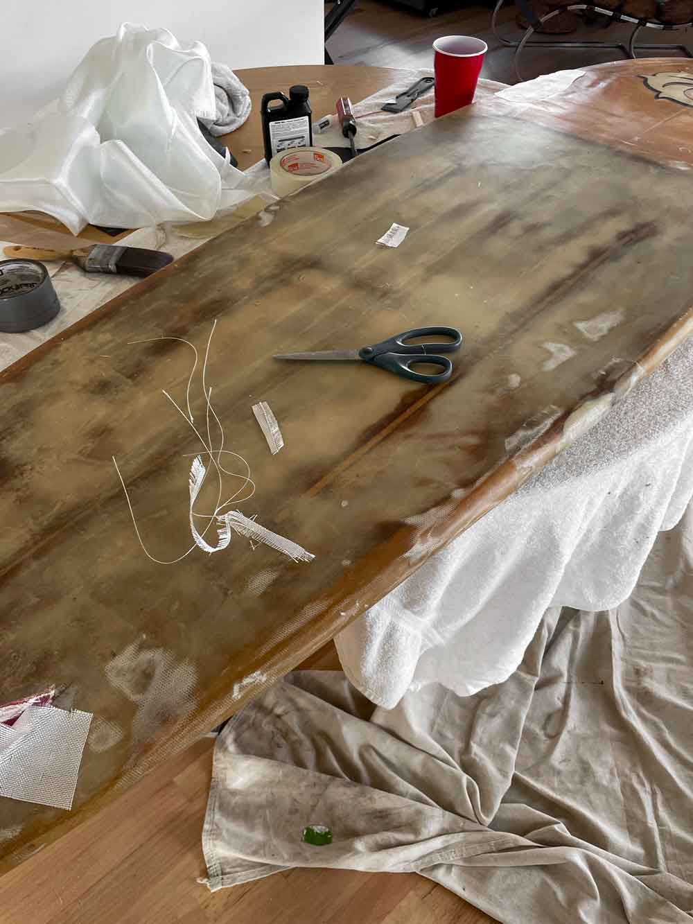 surf board repair by interior designer Patchi Cancado